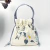 Embroidered Drawstring Bucket Bag with Tassel, Floral and Animal Motifs