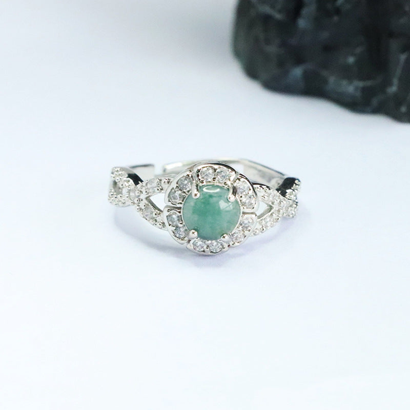 Close-up view of a blue water jade ring with a geometric band