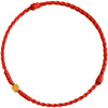 Close-up of a red braided cord bracelet with a small gold square bead