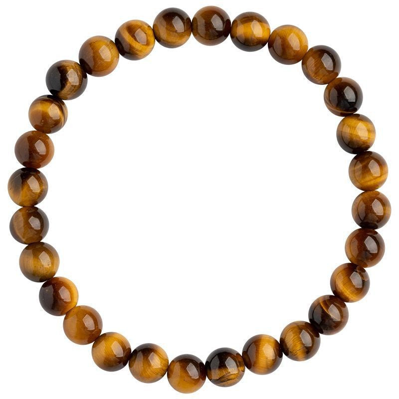 Close up of a yellow tiger eye beaded bracelet on a wrist
