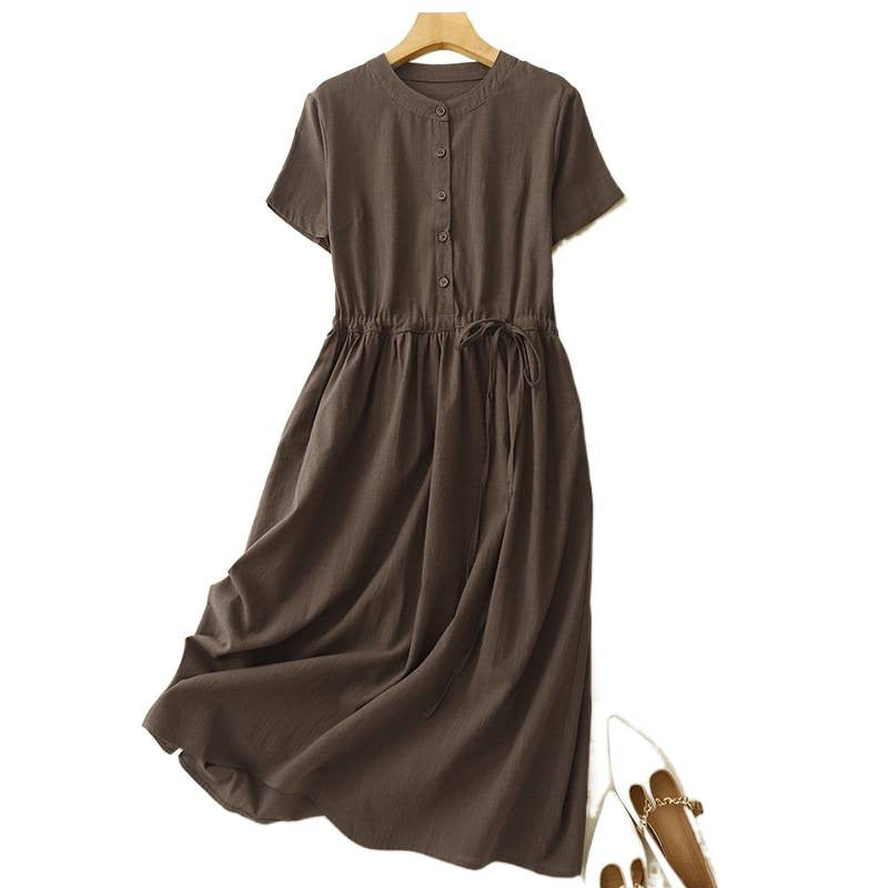 Back view of a dark brown short sleeve midi dress with an elastic waist hanging on a wooden hanger.