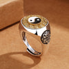 Close up of a copper ring with a spinning Yin Yang and zodiac wheel face