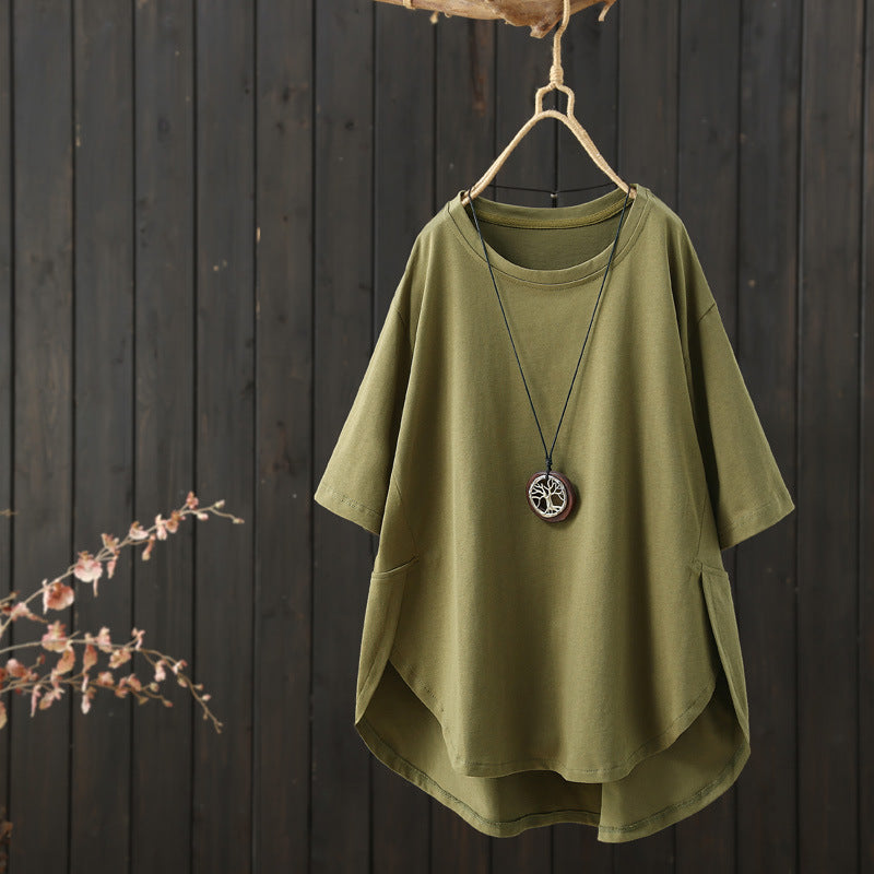 Army green loose fit cotton t-shirt hanging on a wooden hanger