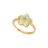 Gold-tone adjustable ring with a pale green five-petal flower design