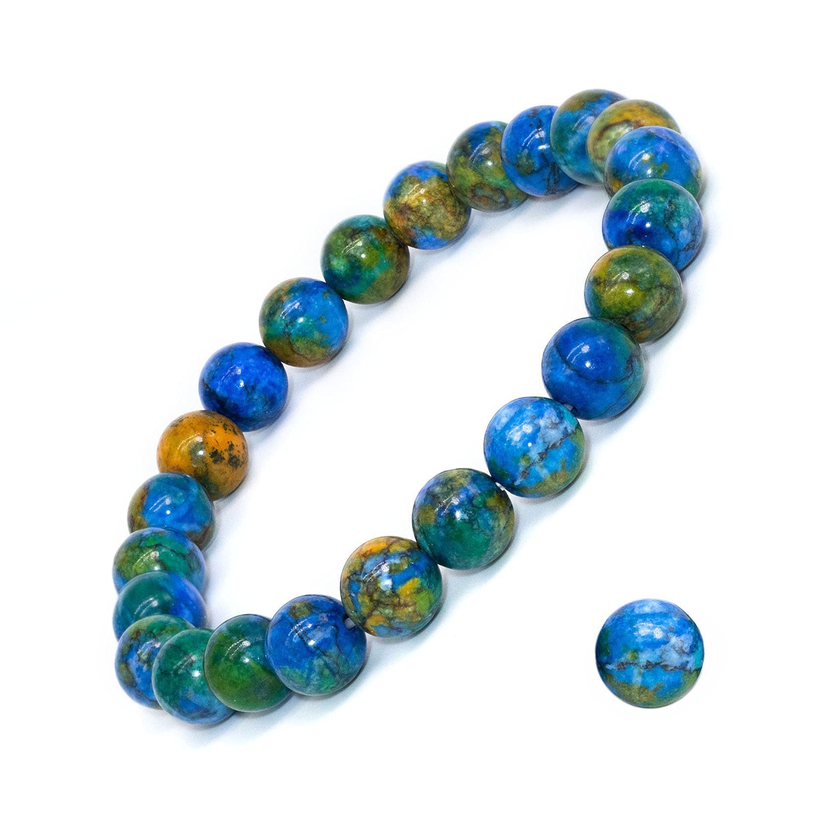 A stretch bracelet made of round blue and green resin beads on a white background