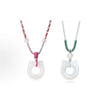 White chalcedony cat ear pendant on a red and grey braided cord