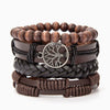 Stack of brown leather wrap bracelets with a Tree of Life charm on a white background
