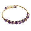 Gold-tone wire wrapped bangle bracelet with purple amethyst beads