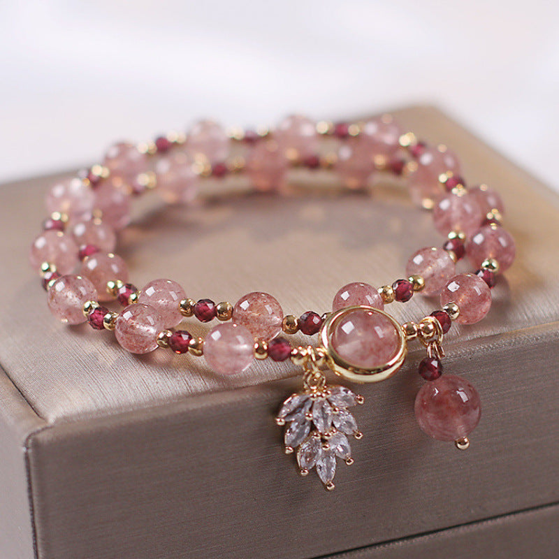 Double wrap bracelet with pink strawberry quartz beads and a gold-tone maple leaf charm