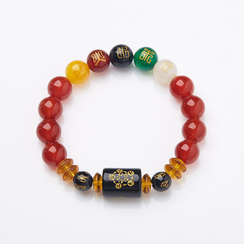 Handmade agate bracelet with five element colored beads and a central black charm on a wrist