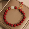 Cinnabar Bracelet with Lucky Cat Charm and White Stone