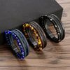 Three multilayered beaded bracelets with evil eye charms on a wooden surface