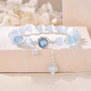 Cat's Eye Glass Bracelet with Star and Moon Charms