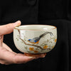 Ceramic Tea Cup with Bird and Flower Motif