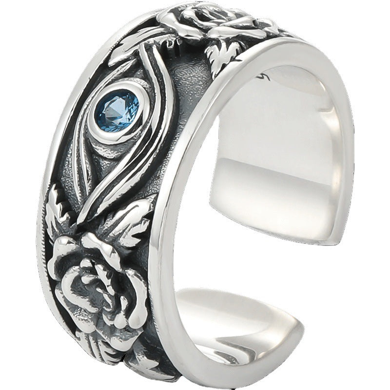Close up view of silver tone adjustable ring with Eye of Horus and rose details