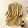 Yellow cotton linen shirt with embroidery on a hanger