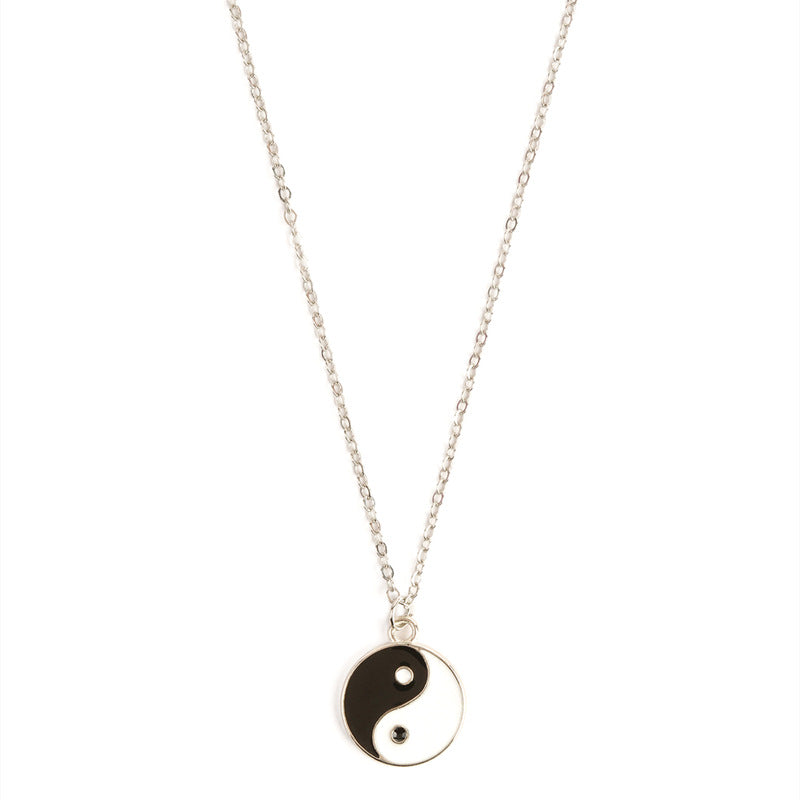 Silver tone necklace with a black and white Yin Yang pendant
