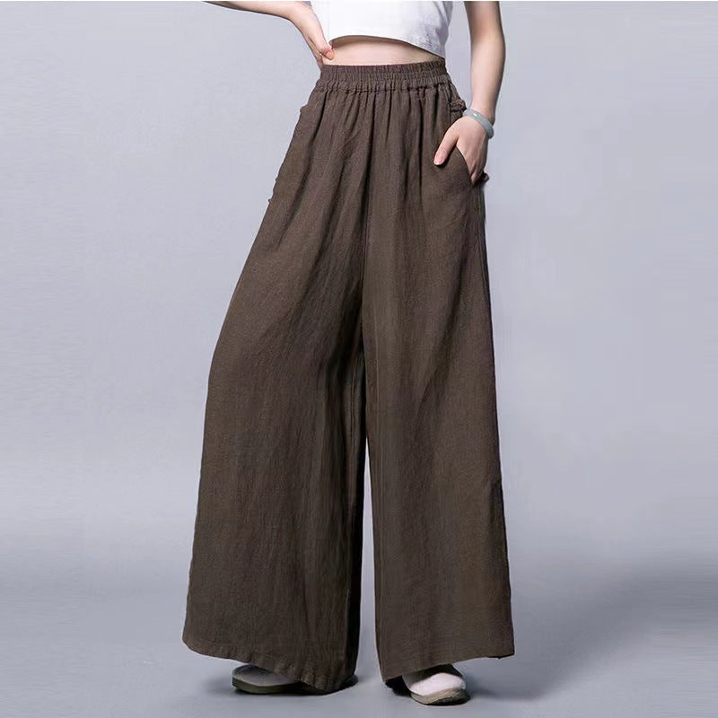 Side view of woman wearing beige wide leg linen pants with frog buttons