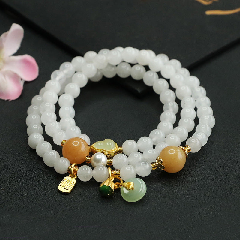 Multi-layer white jade bracelet with yellow accent beads and gold-tone gourd charms