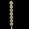Vertical wooden wall hanging with seven carved chakra circles against a green wall