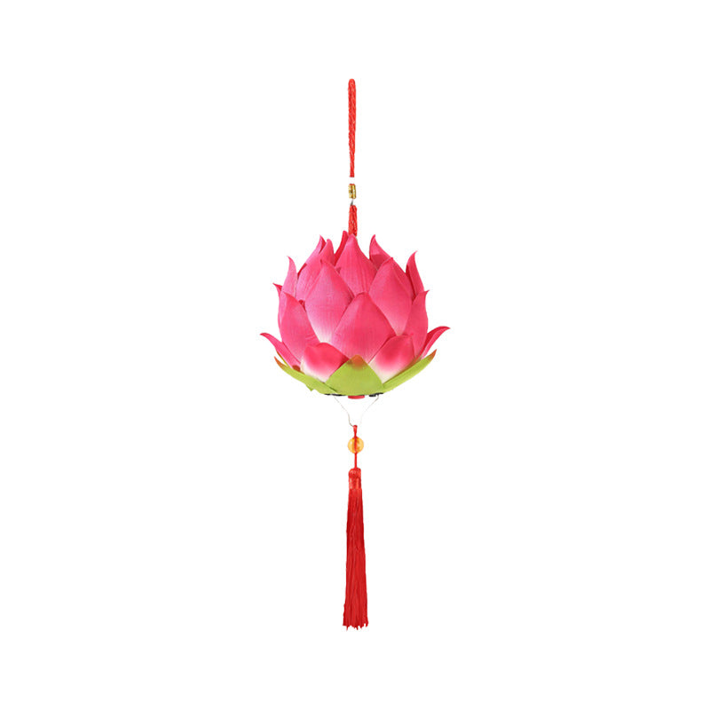 Pink lotus flower lantern hanging with red tassel against white background