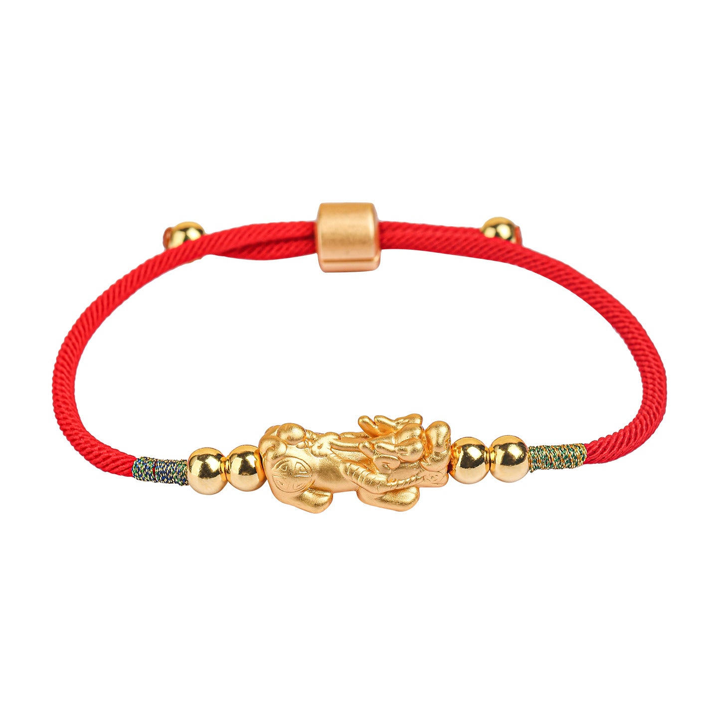 Close-up of a red string bracelet with a silver Pixiu charm worn on a wrist