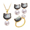 Gold-tone adjustable ring with black shell cat head and white pearl