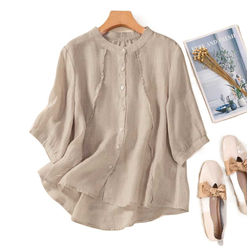 Beige women's short sleeve shirt with stand collar on hanger
