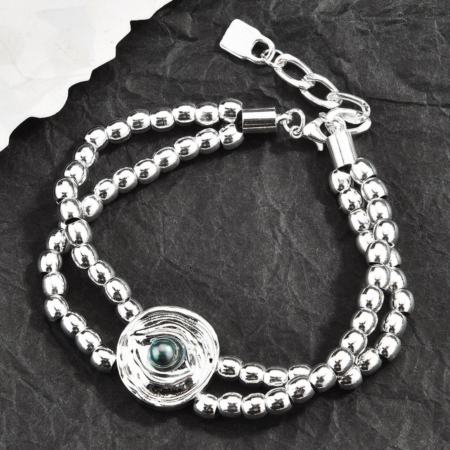 Silver-Plated Beaded Bracelet with Geometric Charms