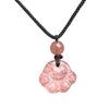 Pink acrylic cat paw pendant hanging on a black cord necklace
