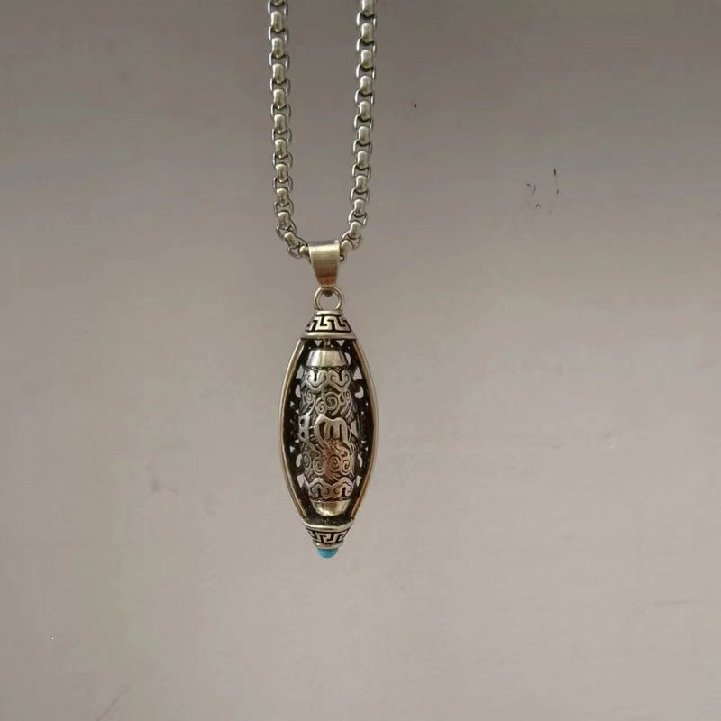 Silver tone rotatable Dzi bead pendant on a box chain necklace