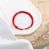 Woven Red String Bracelet with Gold-Tone Bead