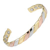 Close up of a three-tone twisted magnetic copper cuff bracelet on white background