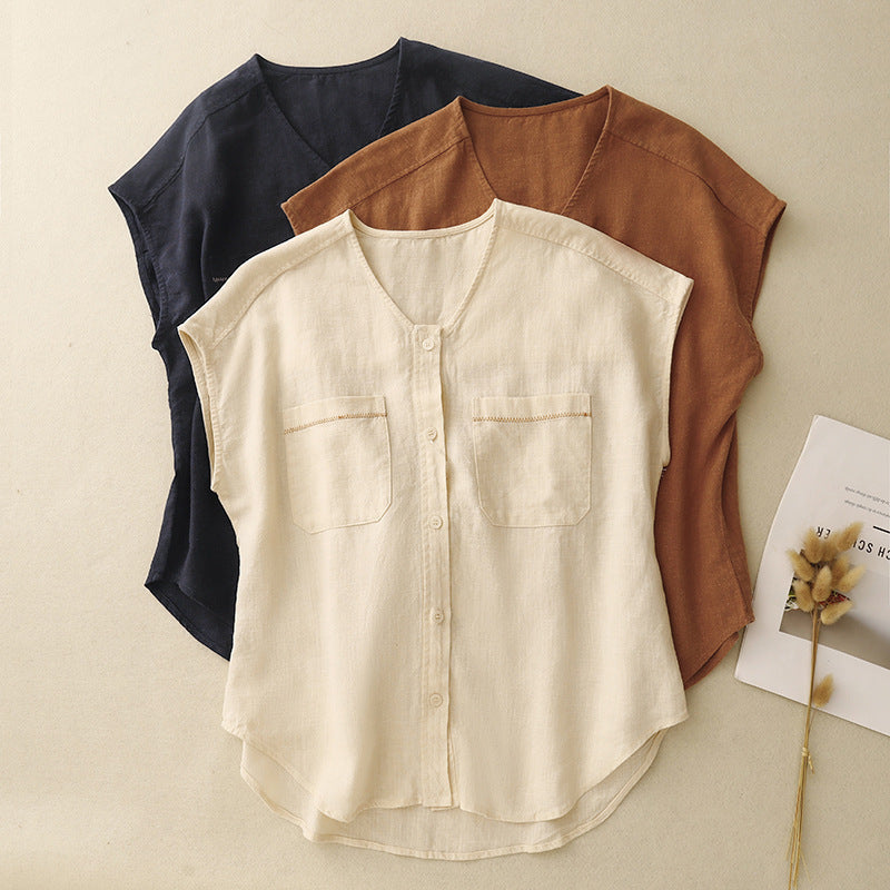 Three women's sleeveless shirts in beige, orange, and dark blue laid flat showing patch pockets