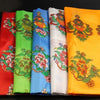 Folded colorful Tibetan Khata scarves with auspicious symbols print