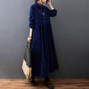 Woman wearing a navy blue long sleeve corduroy midi dress with buttons