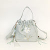 Embroidered Canvas Crossbody Bag with Tassels