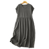 A dark grey cotton linen midi dress with short sleeves hanging on a wooden hanger.