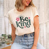 Woman wearing a beige t-shirt with Always Be Kind text and pink flowers