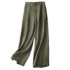 Full view of green wide leg linen pants against a white background