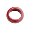 Close up of a red cinnabar ring with a silver zodiac symbol on a finger