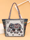 Front view of a beige canvas tote bag with a colorful embroidered elephant design
