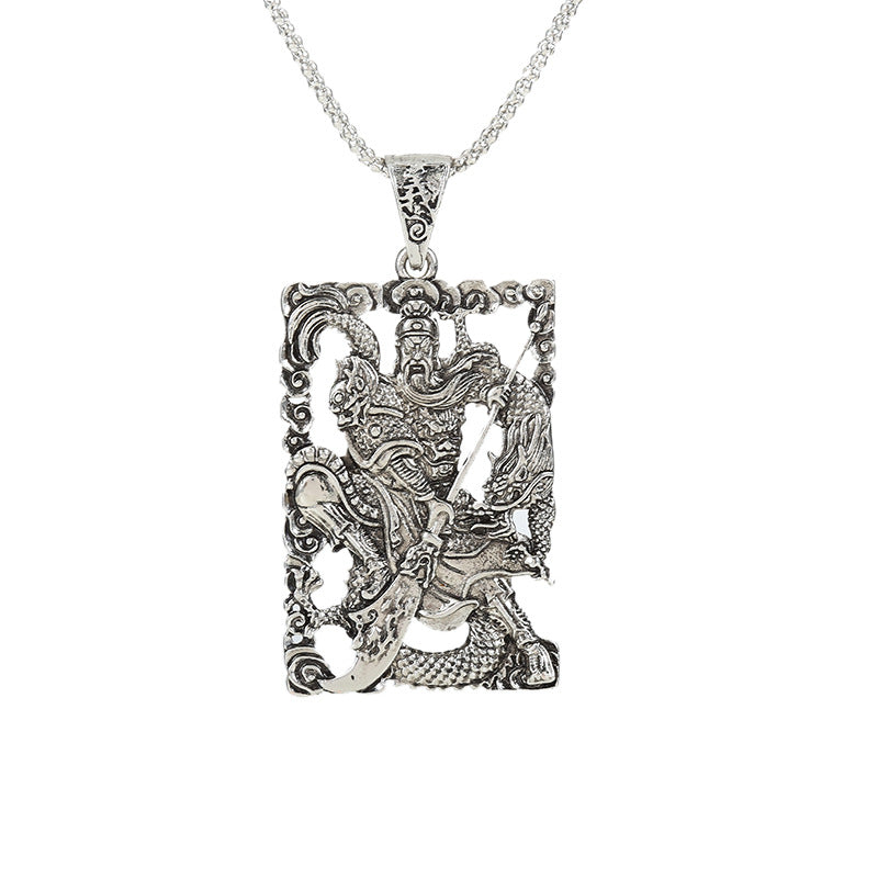 Silver-tone alloy pendant depicting Guan Gong and a dragon on a dark background