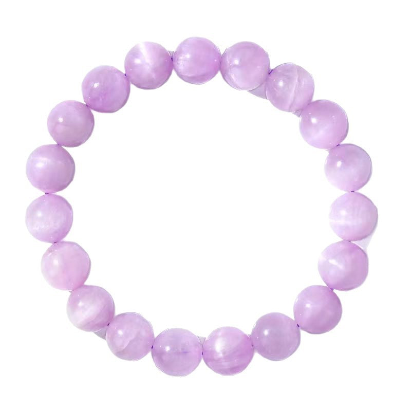 Close up view of a lavender Kunzite beaded bracelet on a white background