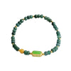 Green abacus bead bracelet with a rectangular green stone charm and gold accents on a white background