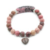 Handmade beaded bracelet with a heart pendant and curved centerpiece