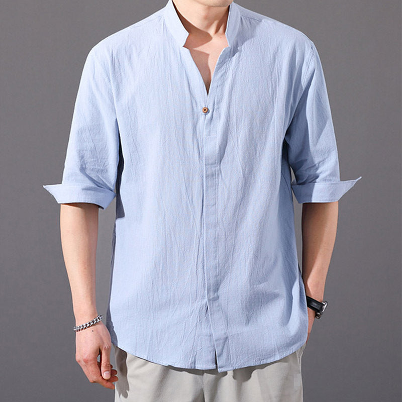 Man wearing a light blue cotton linen half sleeve button shirt with a stand collar