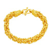 Gold-tone braided bracelet with two dragon head ends on a red background
