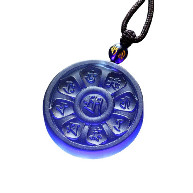 Blue carved glass pendant with Manjusri mantra and lotus pattern on black cord