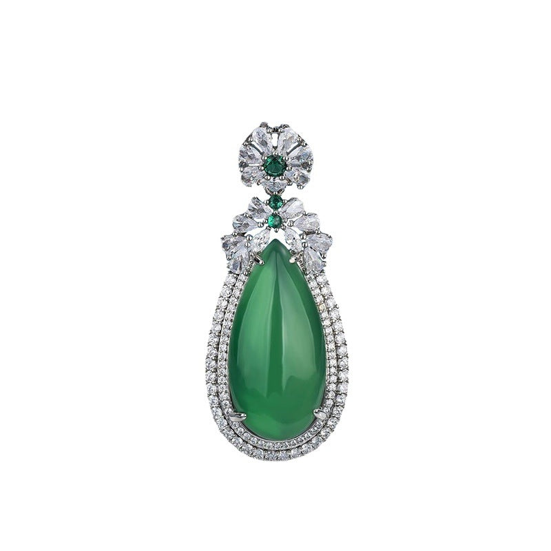 Green teardrop shaped chalcedony pendant with gold tone crystal border